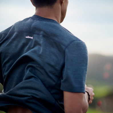 man running in blue shirt